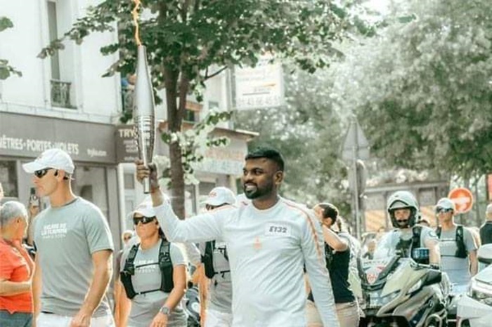 Sri Lanka born celebrity baker Tharshan Selvarajah carries Olympic Torch